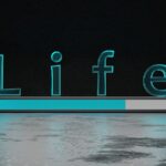 a lit up sign sitting on top of a floor