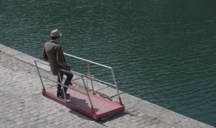man leaning on railings