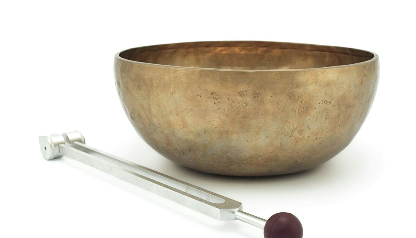 stainless steel spoon beside brown ceramic bowl