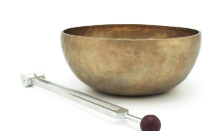 stainless steel spoon beside brown ceramic bowl