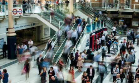 people standing and walking on stairs in mall