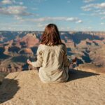 woman sitting on hill